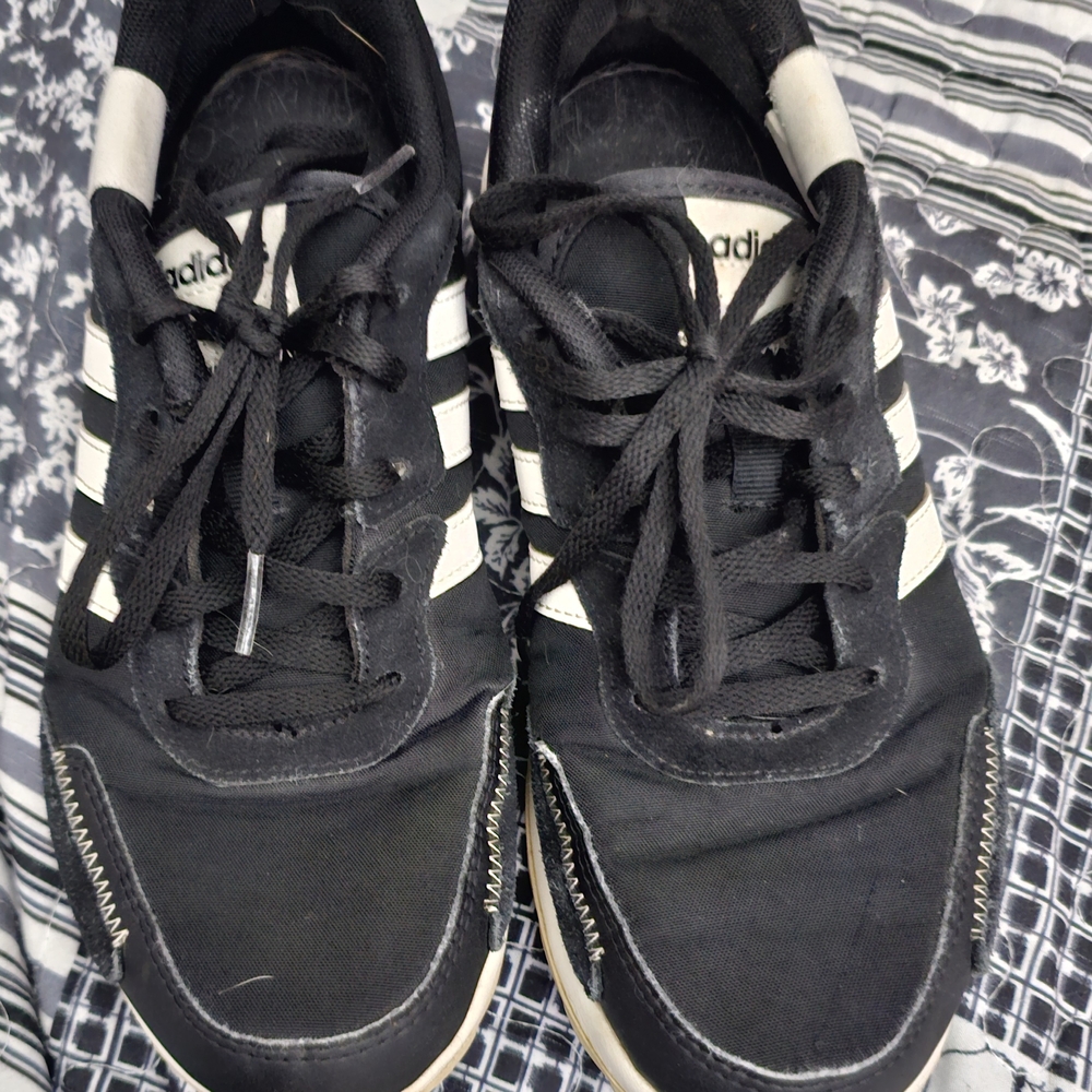 Adidas Black and White Athletic Shoes with Iconic Stripes